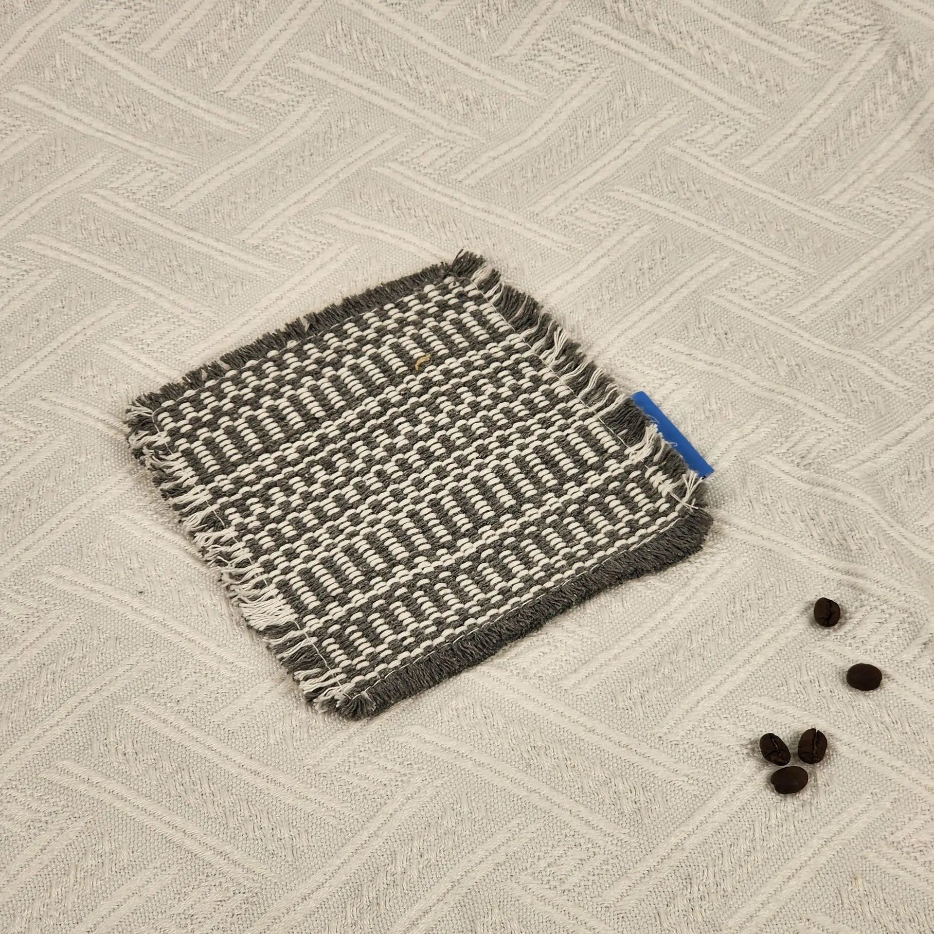 Vintage-inspired, tassel-trimmed woven coasters. checkered square fabric trivets, perfect for coffee, tea, and more Peaceful Pleasures Health and Wellness Gray