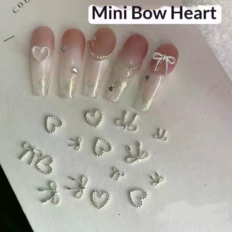 100Pcs 3D Silver Small Bowkont Heart-shaped Ornaments Nail Art Decorations Supplies DIY Alloy Bow Heart Nail Charms Accessories Peaceful Pleasures Health and Wellness