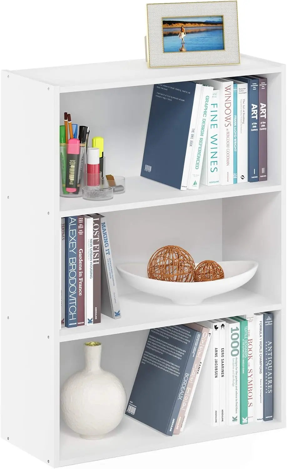 White bookshelf with books, a bowl, and decorative items on a white background