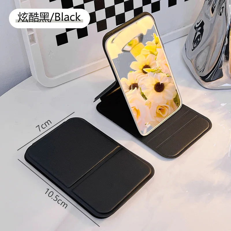 Small Makeup Mirror Portable Folding Girls' Touch-up Mirror Creative High-definition Desktop Standing Mini Portable Small Mirror Peaceful Pleasures Health and Wellness Black-1pcs