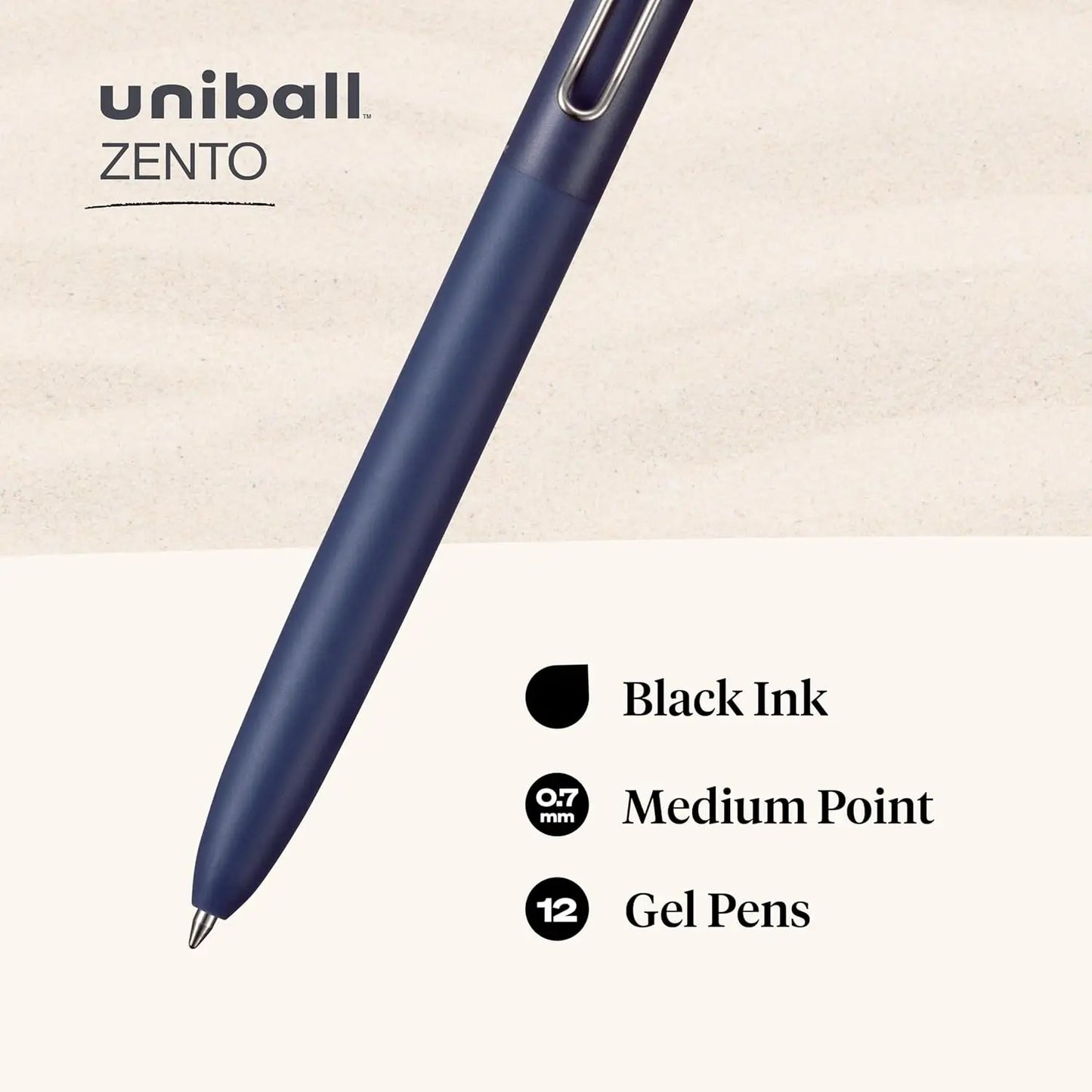 Uniball Zento gel pen with black ink on a beige background