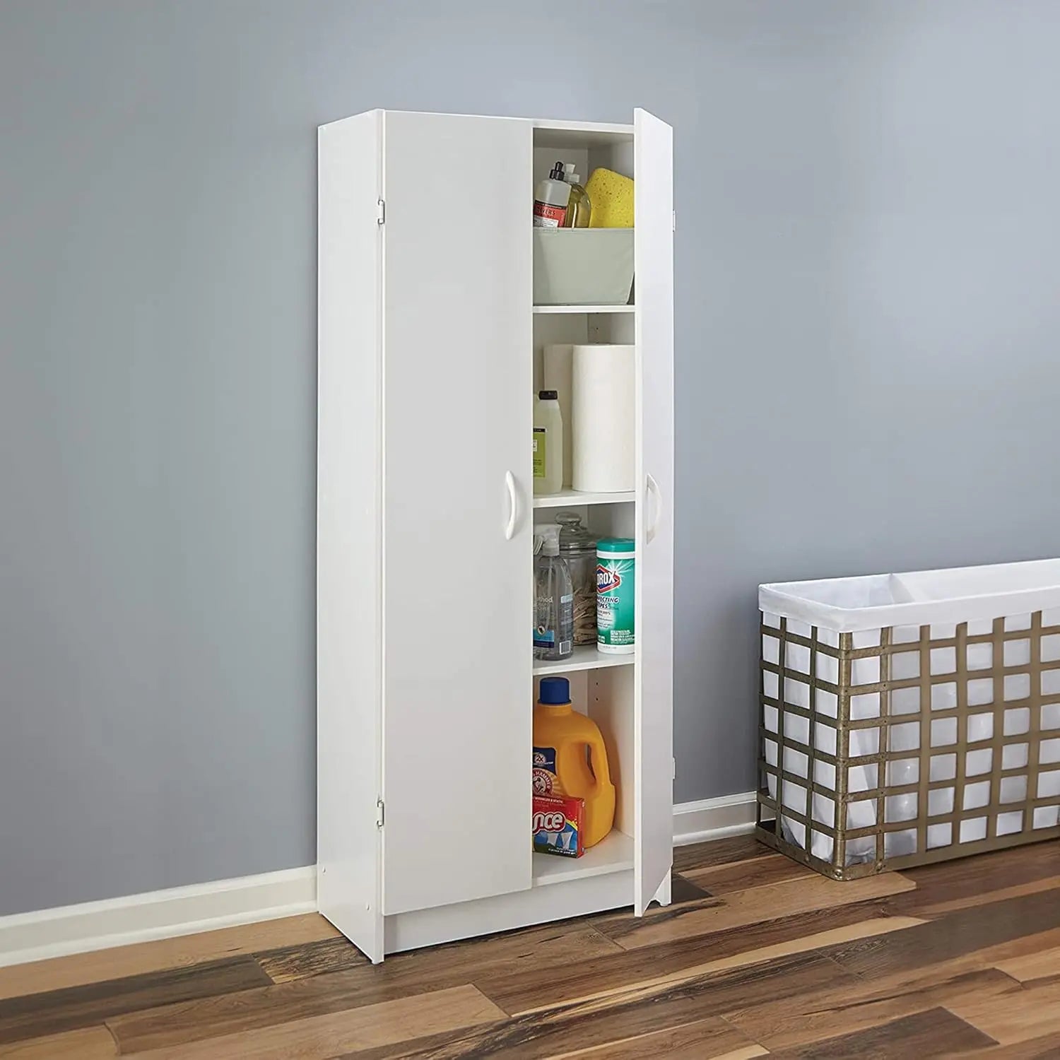 White storage cabinet with shelves against a gray wall, containing various items.
