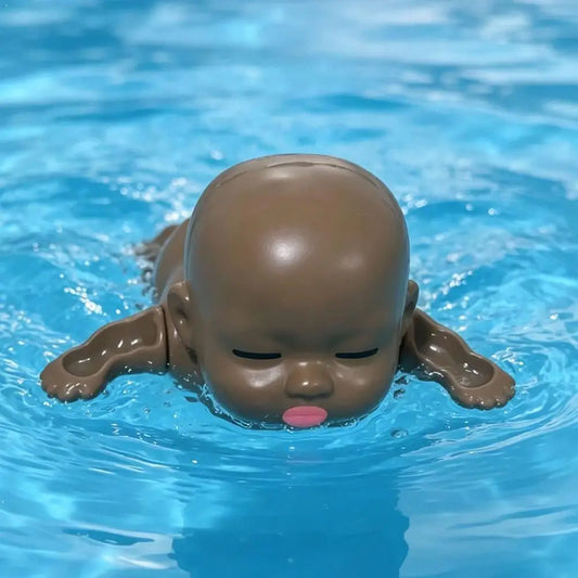 Plastic Wind Up Swimming Baby Doll Toy Realistic Floating Bathtub Peaceful Pleasures Health and Wellness