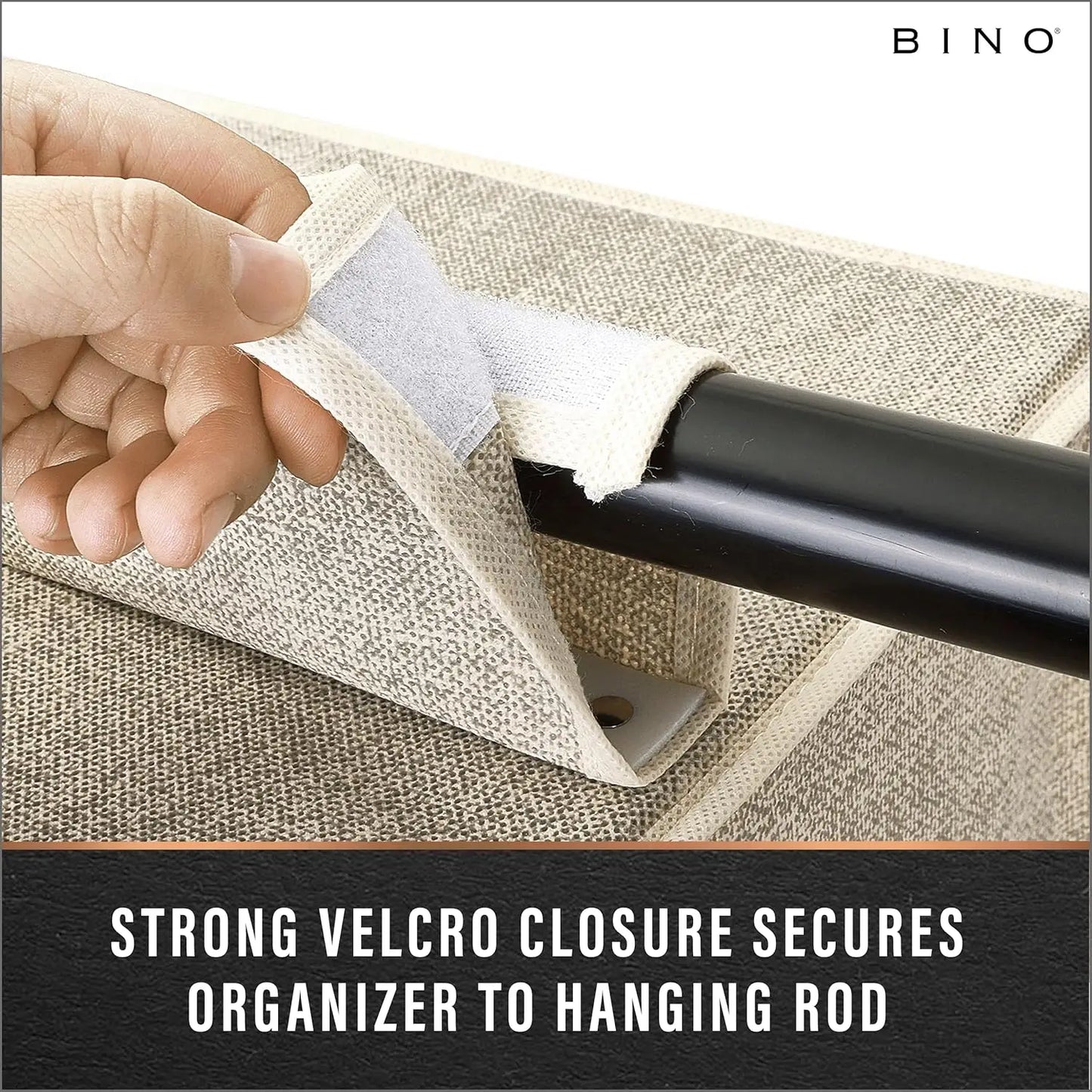 Hand using a strong Velcro closure to secure an organizer to a hanging rod on a textured surface.