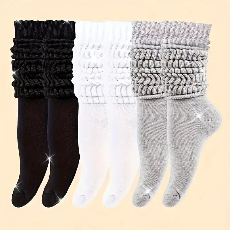Three pairs of solid-colored black, white, and gray stackable socks, stylish and casual, versatile for various outfits. Peaceful Pleasures Health and Wellness