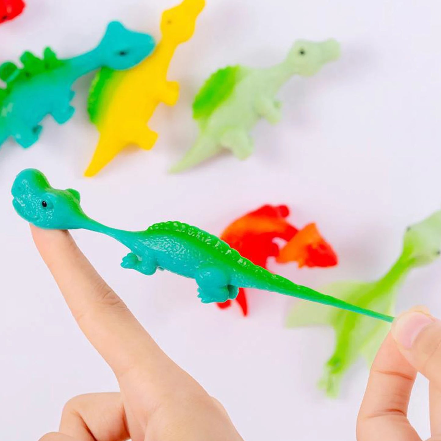 Finger Catapult Dinosaur Toy Funny Mini Rubber Dino Finger Sling Shot Toys for Christmas Birthday Goodie Bag Stuffers Peaceful Pleasures Health and Wellness