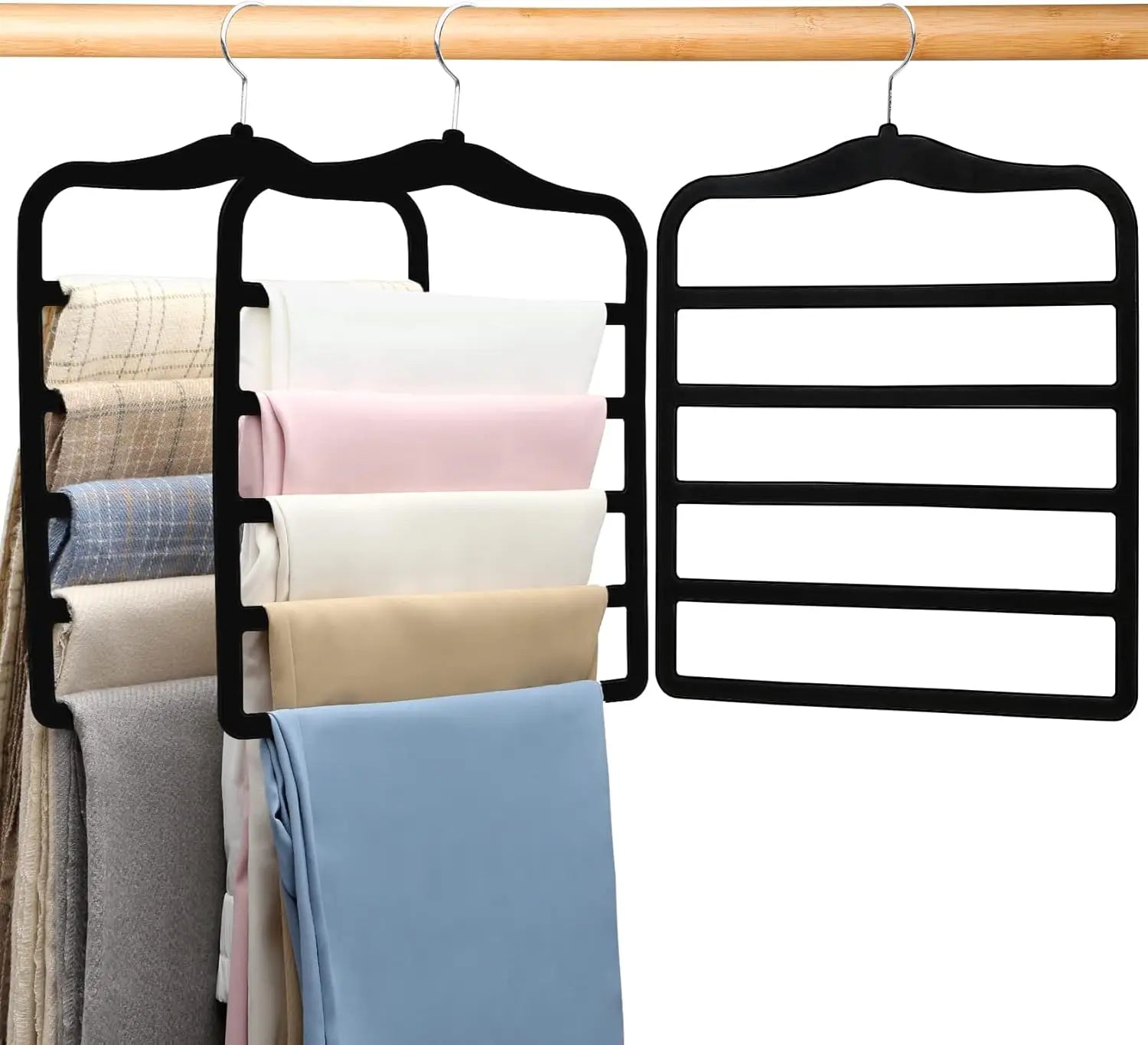 Black multi-shelf hanger with folded clothes on a wooden rod