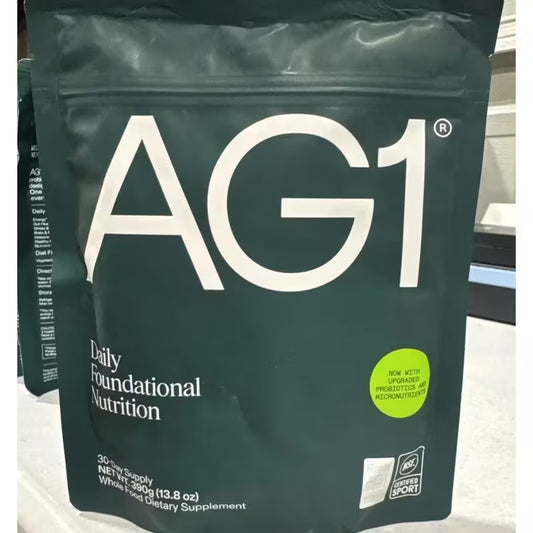AG1 supplement package on a white surface