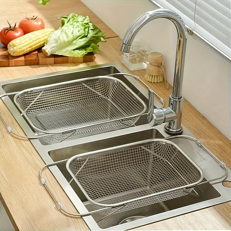 Stainless steel kitchen sink with two baskets on a wooden countertop.