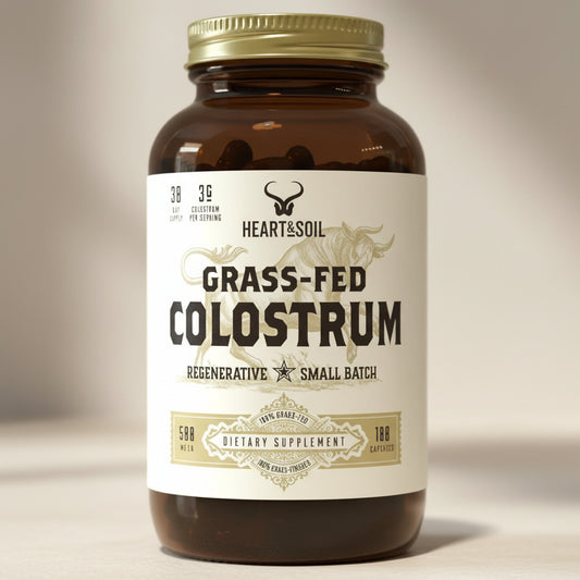 Bottle of Heart & Soil Grass-Fed Colostrum supplement on a white background