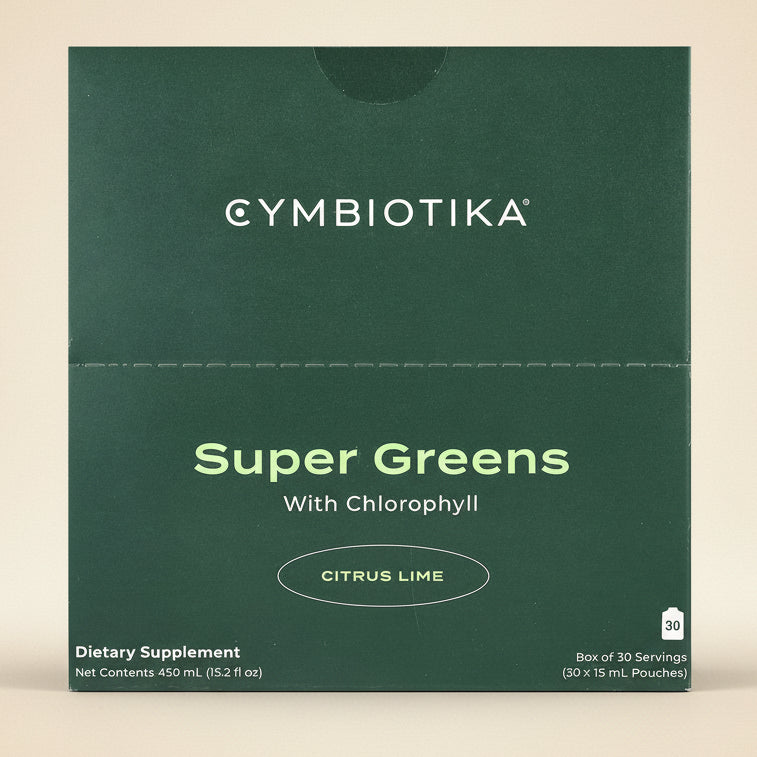Cymbiotika Super Greens with Chlorophyll Citrus Lime dietary supplement packaging on a green background