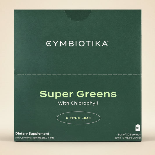 Cymbiotika Super Greens with Chlorophyll Citrus Lime dietary supplement packaging on a green background