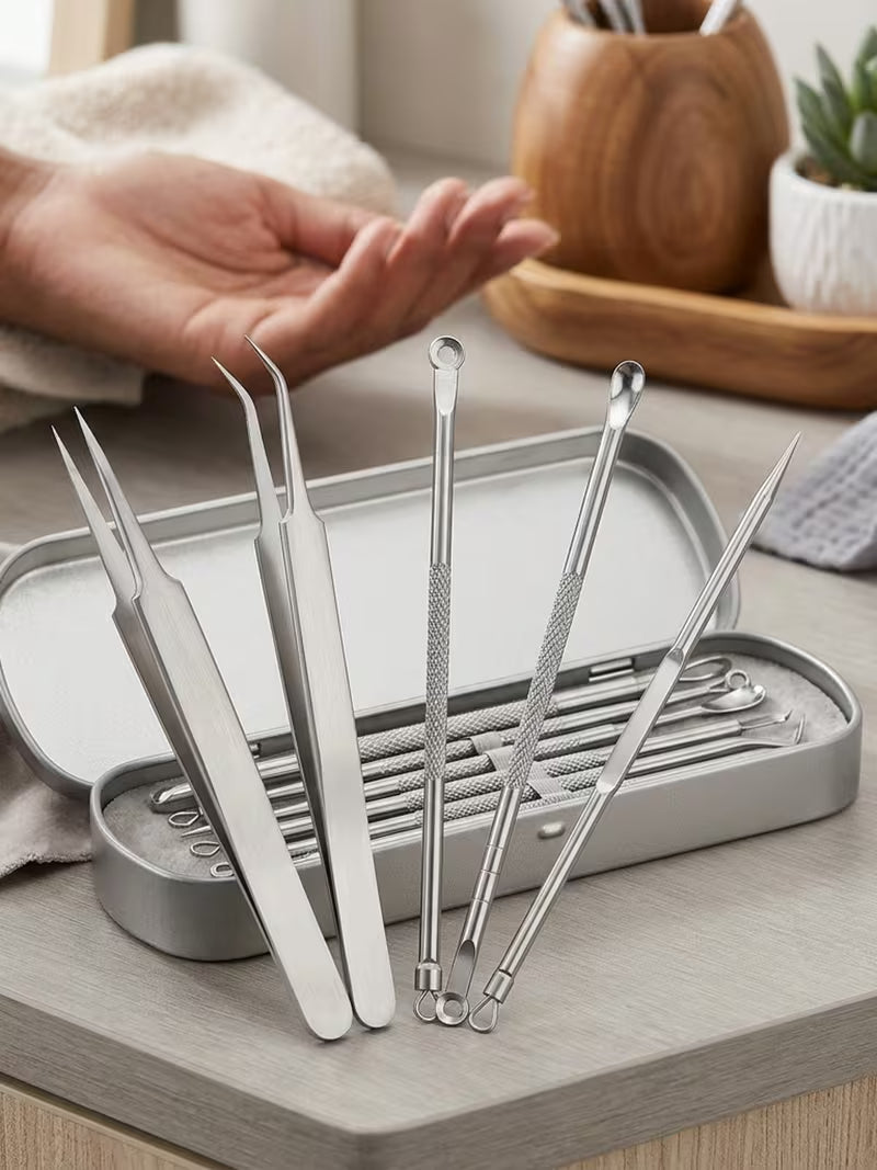 Set of metal tools in a gray case on a wooden surface