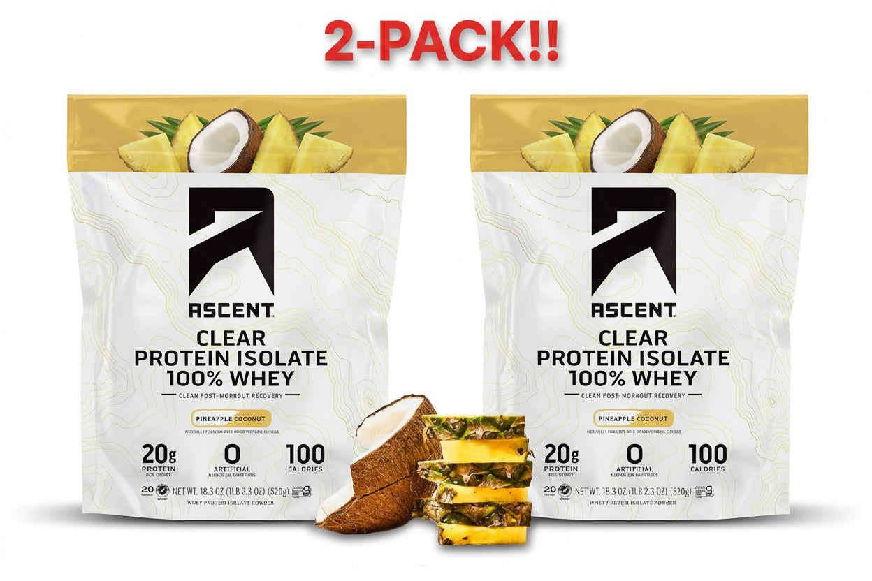 Two packages of Ascent Clear Protein Isolate with pineapple and coconut elements on a white background.