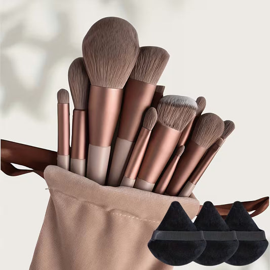 Set of makeup brushes with a beige holder on a light background