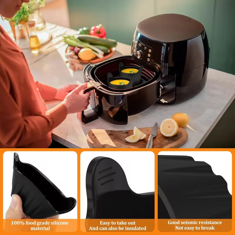 Person using a black air fryer with ingredients on a kitchen counter