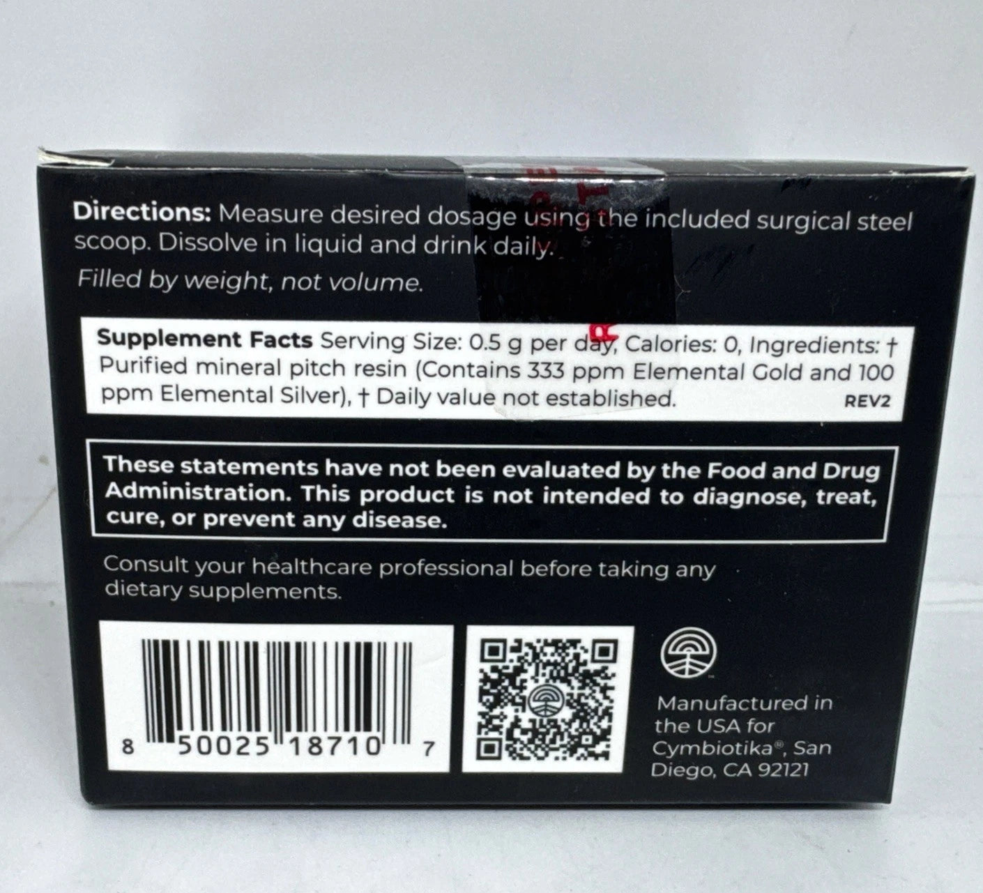 Back of a supplement package with text and a QR code on a white background